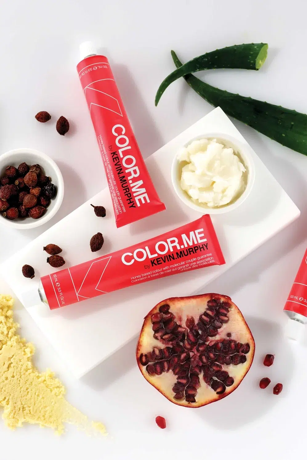 red tubes of color.me by kevin murphy hair color surrounded by natural ingredients
