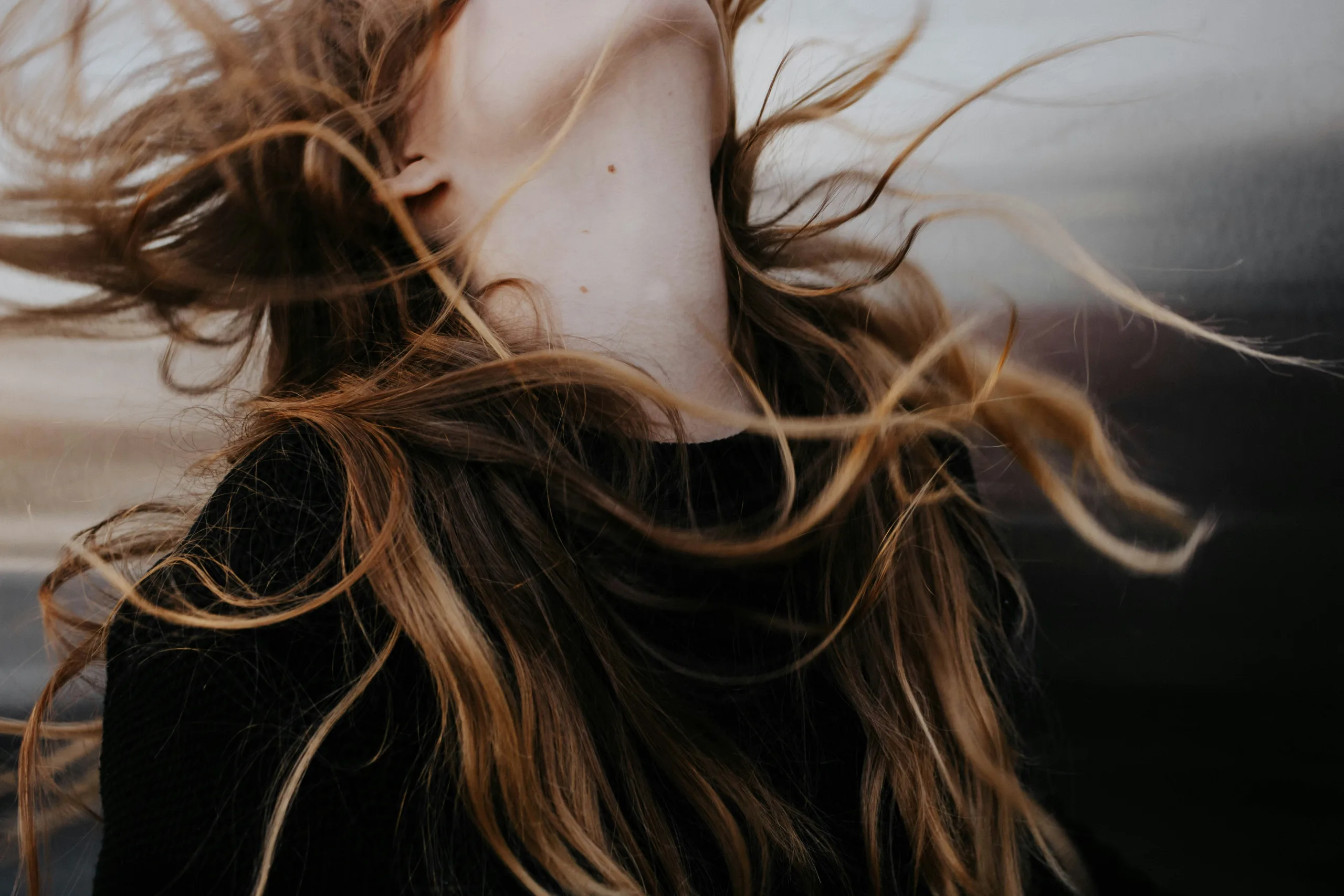 a women with hair blown in the wind