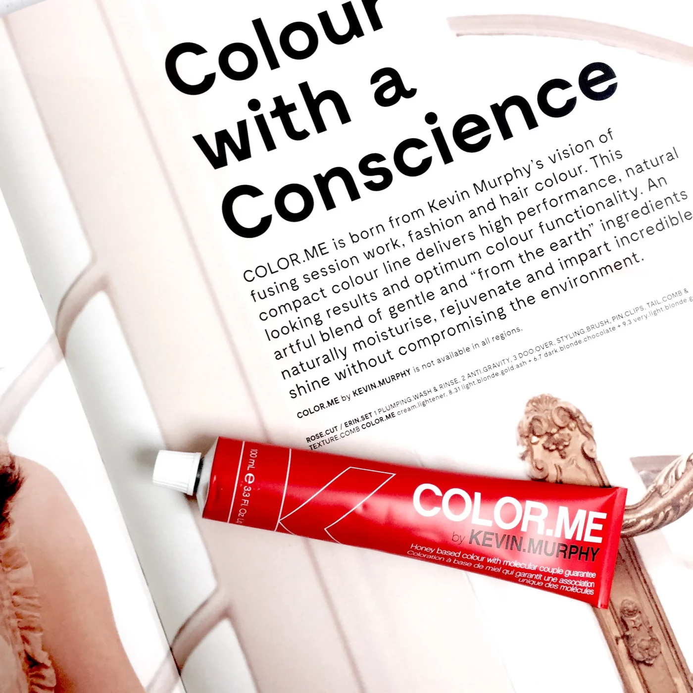 a page in a magazine about conscious hair colouring. On top lays a red tube of color.me by kevin murphy