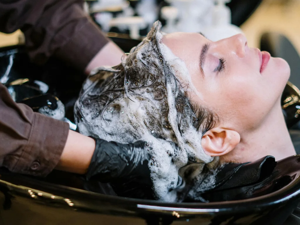 a person enjoying a relaxing hair wash